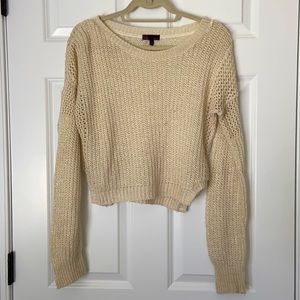 Cream colored sweater with gold flakes